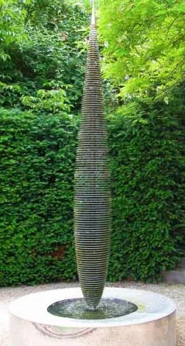 Tall metallic water feature